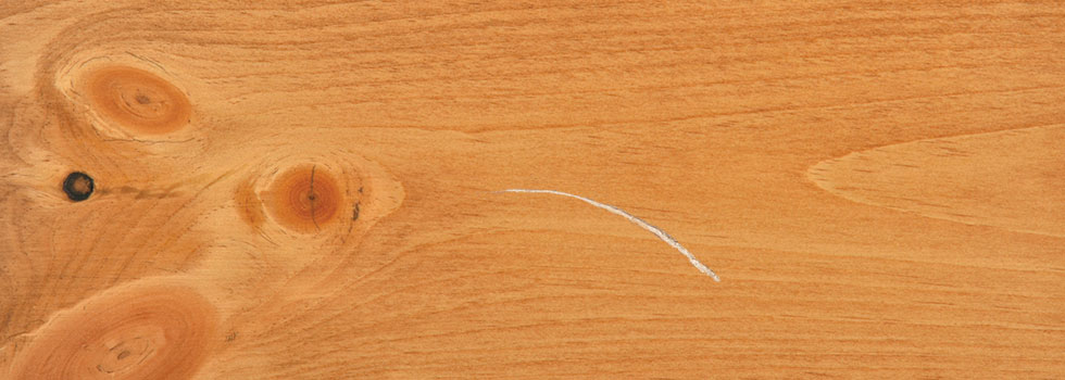 A scratch in wooden furniture