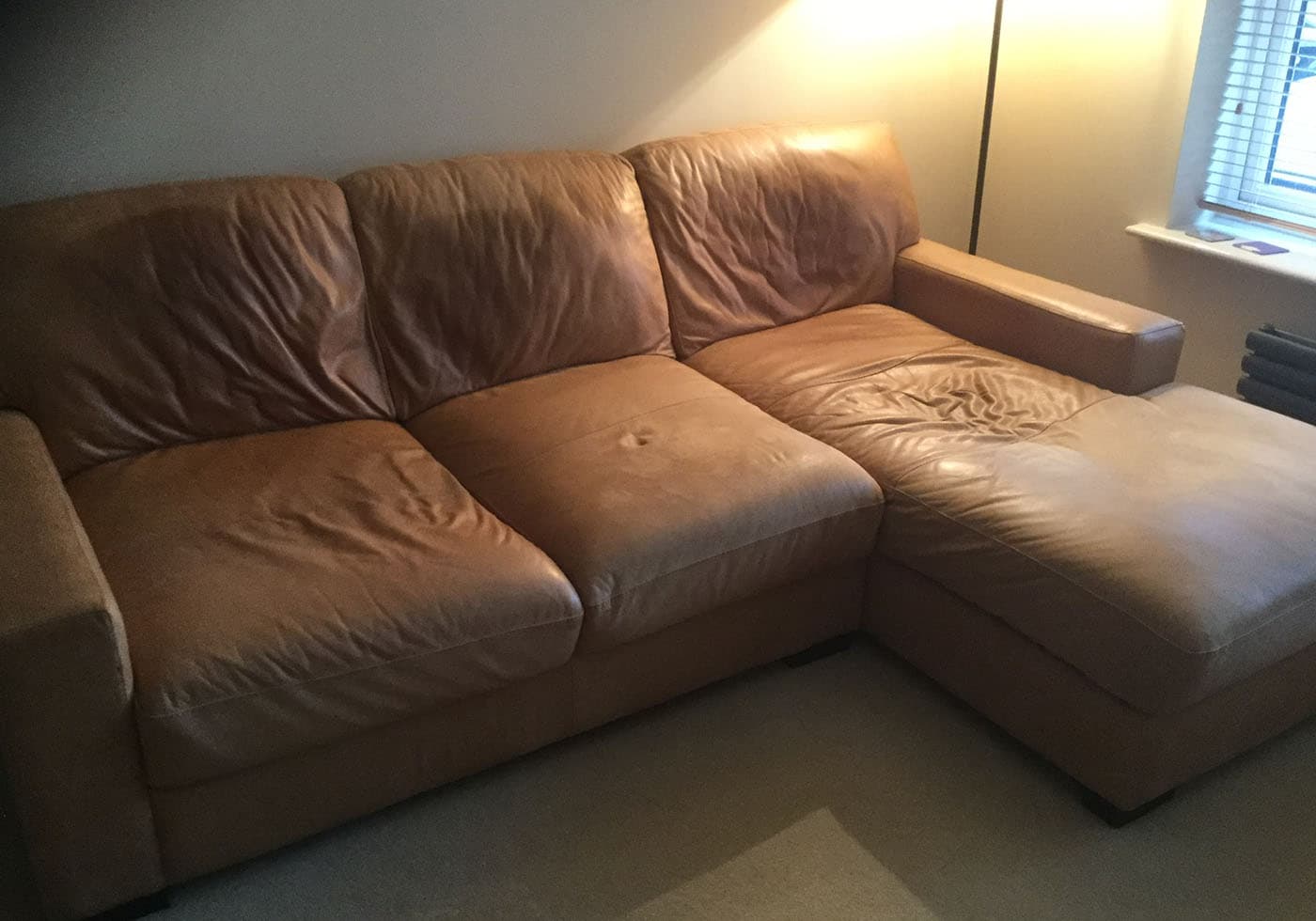 leather sofa with sagging cushions
