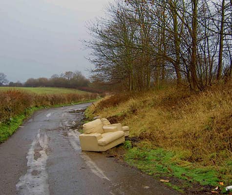 Fly tipped sofa